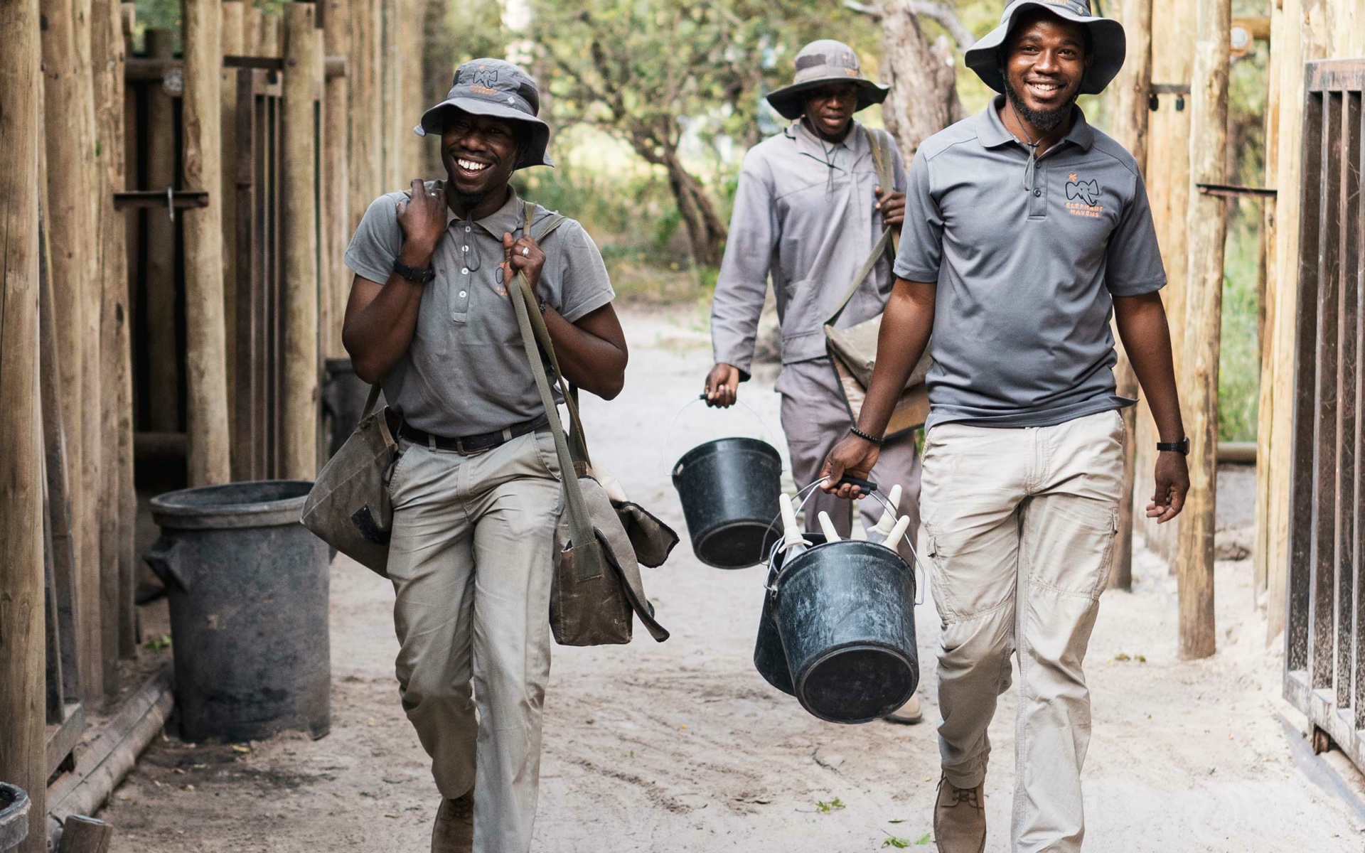 3 Elephant Havens handlers with buckets