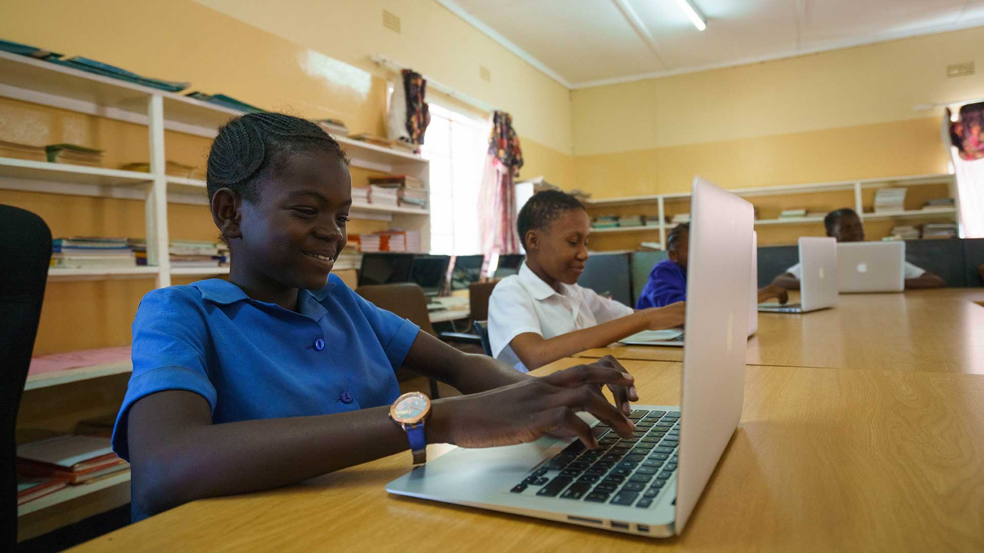 Kids with laptops from Elephant Havens community outreach